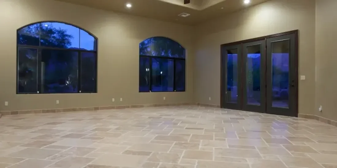 Travertine floor running through a large room